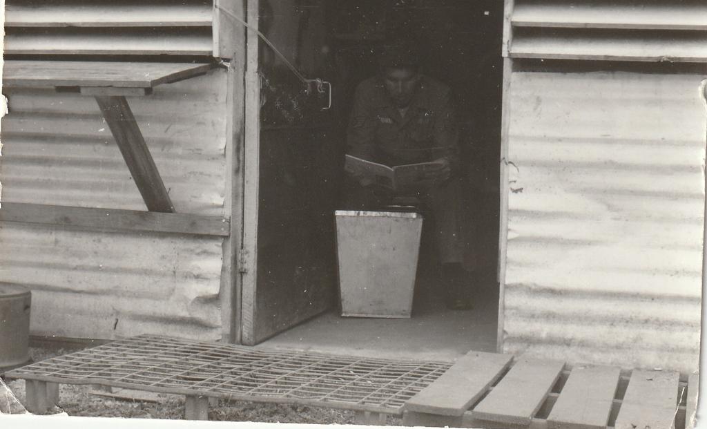 Sgt. Cox giving up my C-Rations as allways to the kids.